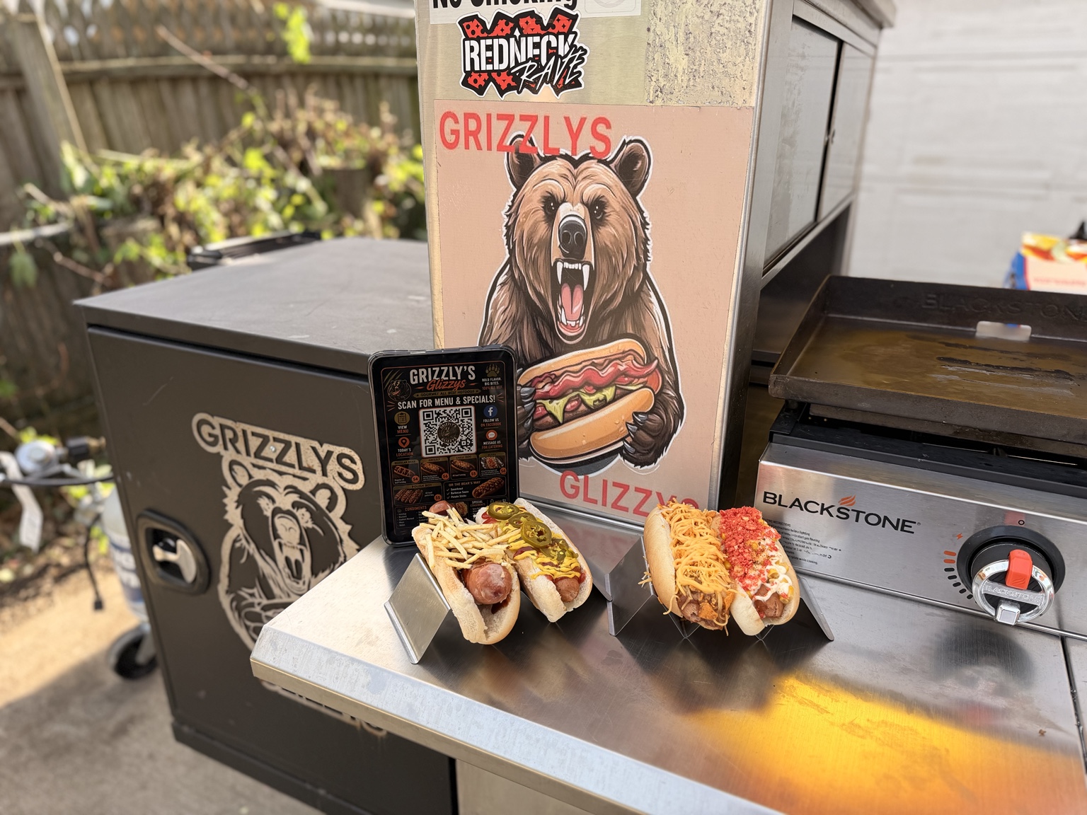 Grizzly's Glizzys hot dogs and cart